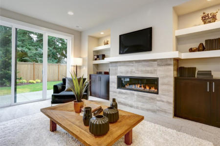 Image of lit livingroom fireplace.